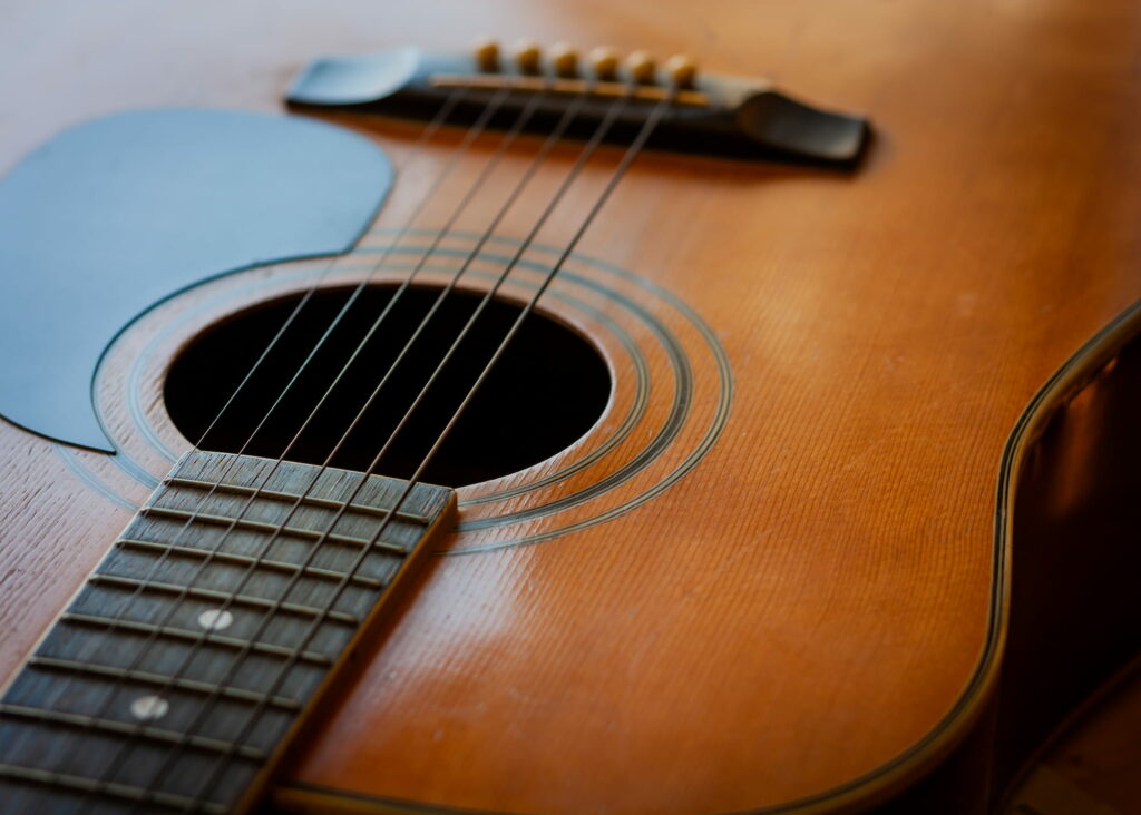 A close up of an acoustic guitar.